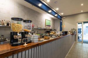 a kitchen with a counter with food on it at TARATA BOUTIQUE HOTEL in Lima