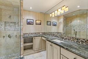 a large bathroom with a shower and a sink at Durant Unit C5, Condo with Bonus Den, Air Conditioning, and Spectacular Views in Aspen