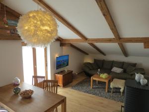 a living room with a couch and a table at Haus Stegen in Maria Alm am Steinernen Meer