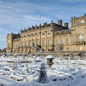 a large building with snow in front of it at Stylish 2 Bed Peak District Cottage Barn - Alton Towers, Scarefest, Polar Bears, Chatsworth in Waterfall