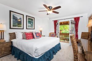 a bedroom with a bed and a ceiling fan at Alpenblick 1, Three Level Townhouse with Fireplace, Private Balcony, and Great Location in Aspen