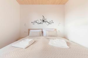 Postel nebo postele na pokoji v ubytování Apartments Nikolaj