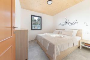 Postel nebo postele na pokoji v ubytování Apartments Nikolaj + 28 fotografií