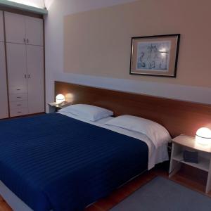 Postel nebo postele na pokoji v ubytování Casaalbergo La Rocca