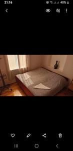 a picture of a bed in a room at Mero House in Kutaisi