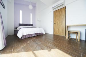 Postel nebo postele na pokoji v ubytování Young Stay 好漾