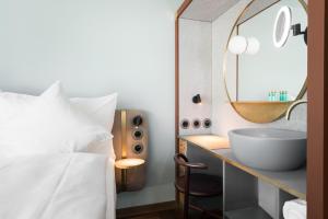 Voodi või voodid majutusasutuse Hotel Aare Thun toas