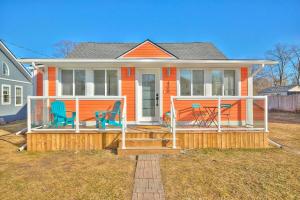 a house with two chairs on a porch at Beachside Abode Crystal Beach in Fort Erie