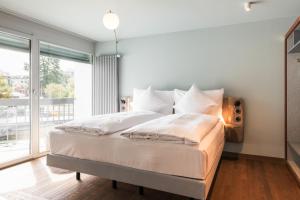 Voodi või voodid majutusasutuse Hotel Aare Thun toas