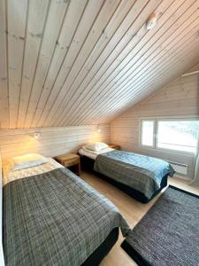 Ένα ή περισσότερα κρεβάτια σε δωμάτιο στο Himos Villa Himalaja