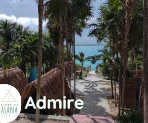 a walkway to the beach with the name almaime at Glamping Asana Bacalar in Bacalar