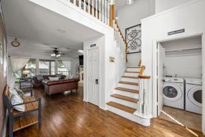 a laundry room with a washer and dryer at 5BR Train Theme Heated Pool Hot Tub EV BBQ in Spring