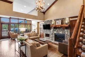 a large living room with a stone fireplace at Lion Square Lodge East 313 in Vail