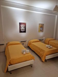 Katil atau katil-katil dalam bilik di La Camera sul Corso