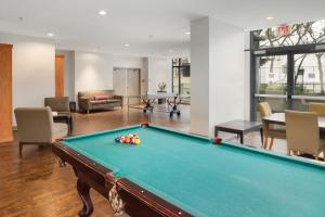 a living room with a pool table at WorldMark Vancouver The Canadian in Vancouver