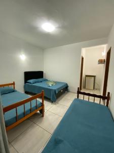 Кровать или кровати в номере Pousada econômica bon vivant arraial do cabo