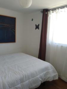 A bed or beds in a room at Condominio Mirador de Coquimbo
