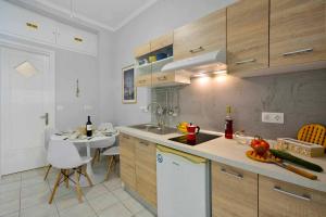 a kitchen with a sink and a counter top at Casa Mia Apartment in Corfu
