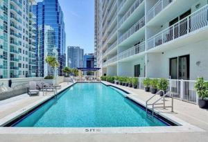 a swimming pool in the middle of a building at Modern 1 Bed in the Heart of Brickell With Free Parking in Miami