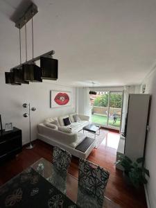 a living room with a couch and a table at Jumeke Home in Castro-Urdiales