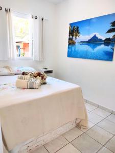 Cama ou camas em um quarto em Pousada Atobá Juquehy Apartamentos