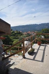 a balcony with a view of a mountain at Casinha Estrela da Encosta - Gerês in Vieira do Minho