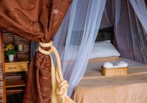 Postel nebo postele na pokoji v ubytování Glamping Mirador Santa Fe-Sopetran