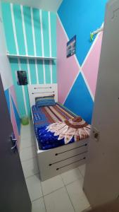 a small bedroom with a bed in a room at 05 Burjuman metro stations Unisex Hostel Private room - 05 in Dubai