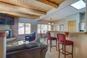 a living room with a couch and a bar at Amalia Mountain Getaway with Deck, Fireplace! 