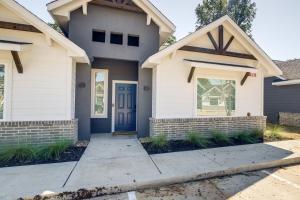 a house with a blue door and a sidewalk at Houston Home with Private Yard Near The Galleria in Hot Wells