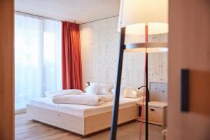 Postel nebo postele na pokoji v ubytování Bio-Hotel Oswalda-Hus