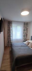 Cama o camas de una habitación en Zakręt Solina 537-791-246