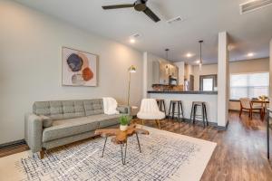a living room with a couch and a table at Newly Built Corner Hideaway about 3 Mi to Texas AandM in College Station