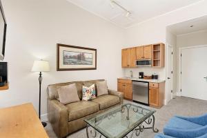 A seating area at Independence Square 213, Spacious Hotel Room with 2 Queen Beds, Wet Bar, and Sitting Area