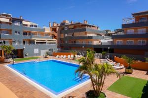 an image of a swimming pool in a building at South Coast Apartment in Puertito de Güímar