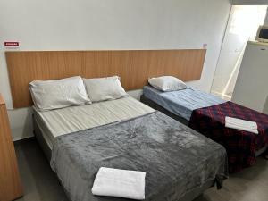Giường trong phòng chung tại Studio 23m² Zona Norte/SP ao lado Expo Center Norte