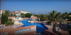 a view of a swimming pool at a resort at Mobil-home 5 personnes dans camping Mar Estang 4 étoiles avec accès à la plage in Canet-en-Roussillon