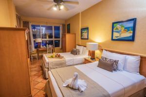 Ένα ή περισσότερα κρεβάτια σε δωμάτιο στο Best Western Posada Freeman