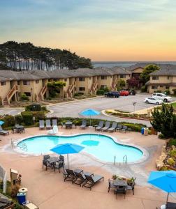 an overhead view of a pool with chairs and umbrellas at Seascape Ocean View Condo in Aptos