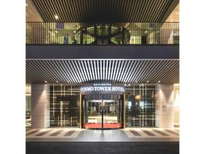 a view of the front of a building with a revolving door at Sakishima Cosmo Tower Hotel - Vacation STAY 01075v in Osaka