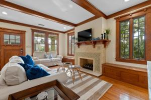 a living room with a couch and a fireplace at Flagler Cottage - 1 Block to Historic District in Saint Augustine