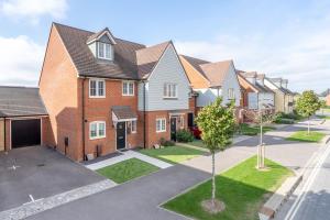 a row of houses in a residential neighbourhood at Chichester Cinema House near Witterings and Goodwood Estate in Chichester