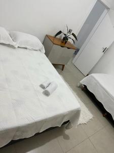 Cama ou camas em um quarto em Hospedagem Espaço Rose Souza - Centro Histórico de Petrópolis - Aluguel de quartos