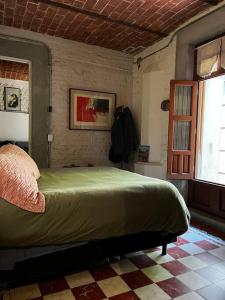 a bedroom with a large bed in a room at Departamento Arcano in Mexico City