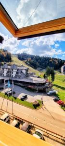 a view of a marina from a window of a building at Planinska kuća II in Jahorina