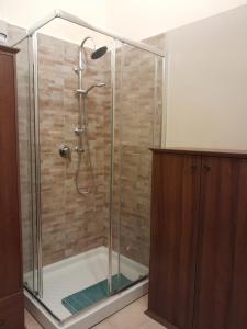 a shower with a glass enclosure in a bathroom at Casa Castelli Appartamento vacanza in Bagheria