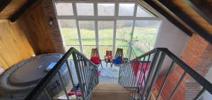 an overhead view of a staircase with a large window at Vikendica OM relax in Prijedor
