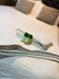 two bottles of medicines sitting on a bed at The Beeches, Ashby-de-la-Zouch in Ashby de la Zouch