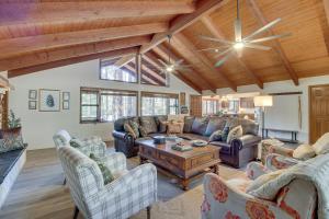 A seating area at Pinetop Cabin with 2 Fireplaces and Hot Tub!