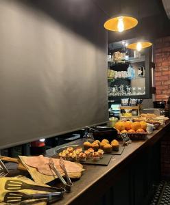 a counter in a kitchen with some food on it at The Wellington Hotel Birmingham - Breakfast Included City Centre Near O2 Academy in Birmingham